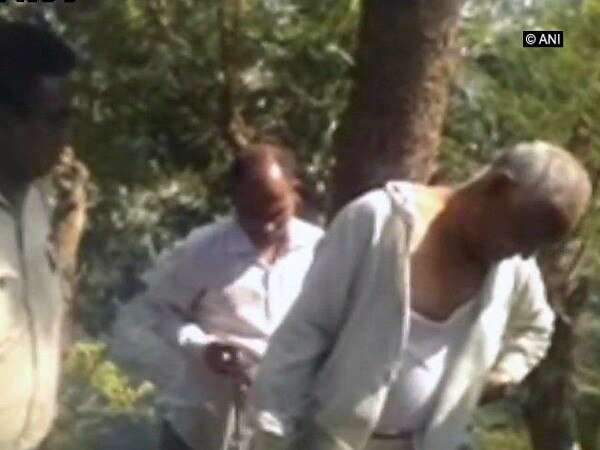 Residents tie BJP corporator to tree, beat him up in Vadodara Residents tie BJP corporator to tree, beat him up in Vadodara