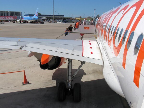 Trying to get some fresh air, passenger opens plane's emergency door Trying to get some fresh air, passenger opens plane's emergency door