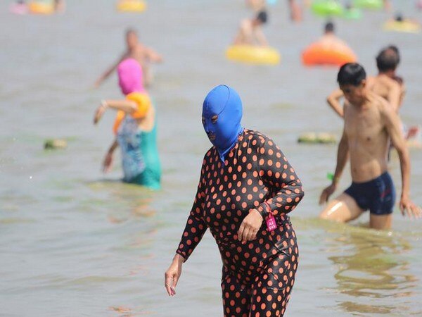 With onset of summer, 'Facekinis' make a comeback in Chinese beaches With onset of summer, 'Facekinis' make a comeback in Chinese beaches