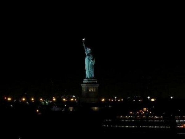 Woman climbs onto the base of State of Liberty protesting immigration policy Woman climbs onto the base of State of Liberty protesting immigration policy