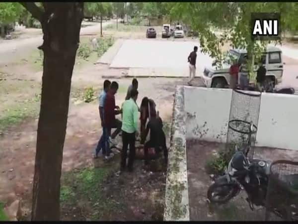 MP: Man thrashed outside police station, SHO gets show cause notice MP: Man thrashed outside police station, SHO gets show cause notice