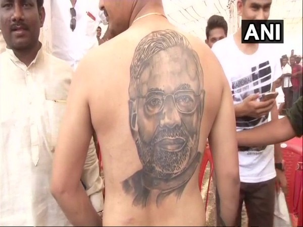 Karnataka: Man gets PM Modi's face tattooed as show of support Karnataka: Man gets PM Modi's face tattooed as show of support
