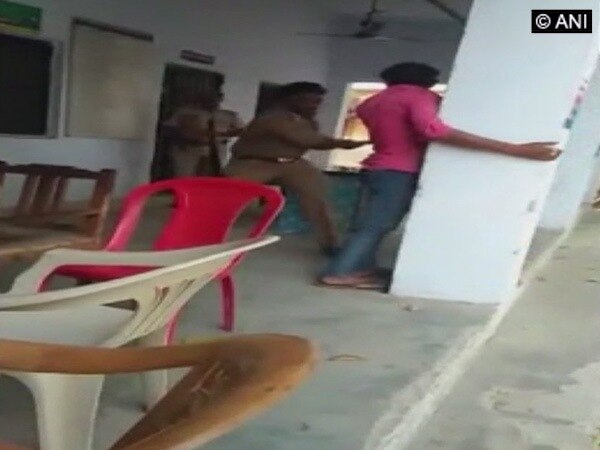 Sub-Inspector beats up rape accused with belt, video goes viral Sub-Inspector beats up rape accused with belt, video goes viral