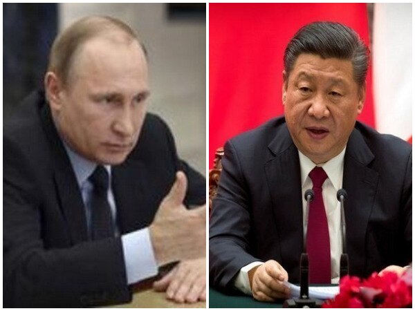 Xi gifts Putin China's friendship medal Xi gifts Putin China's friendship medal