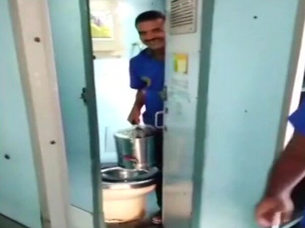 Vendors fill tea cans from train toilet, fine on contractor Vendors fill tea cans from train toilet, fine on contractor