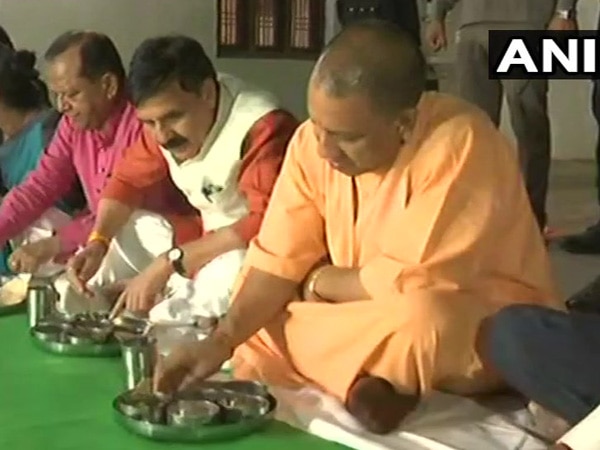 Yogi dines at Dalit family's home in Pratapgarh Yogi dines at Dalit family's home in Pratapgarh