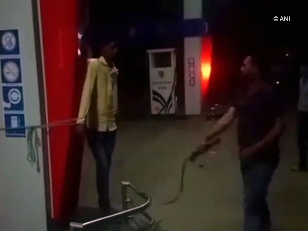 MP shocker: Petrol pump owner whips employee for being absent MP shocker: Petrol pump owner whips employee for being absent