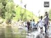 J-K: Students dangerously cross Tawi river to reach school