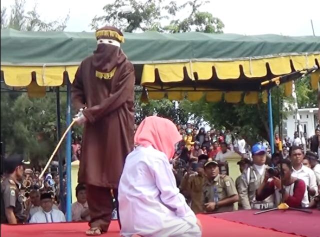 Shocking video: For selling alcohol, Christian woman caned in Indonesia's Aceh province Shocking video: For selling alcohol, Christian woman caned in Indonesia's Aceh province