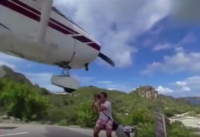 Whoa: Watch plane nearly misses tourist's head while landing in St. Barts Whoa: Watch plane nearly misses tourist's head while landing in St. Barts