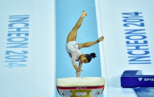 India's Dipa Karmakar performs in the women's vault final of the artistic gymnastics event during the 2014 Asian Games at the Namdong Gymnasium in Incheon on September 24, 2014. AFP PHOTO / JUNG YEON-JE / AFP PHOTO / JUNG YEON-JE