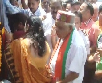 Shocker! Babulal Gaur touches woman inappropriately Shocker! Babulal Gaur touches woman inappropriately