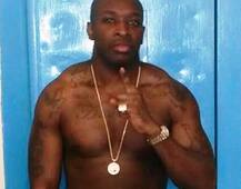Drugs & guns: Gangster serving 27 years poses with Rolex watch & Versace bling in prison