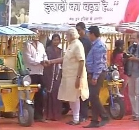 PM Modi takes a ride on e-rickshaw in Varanasi PM Modi takes a ride on e-rickshaw in Varanasi