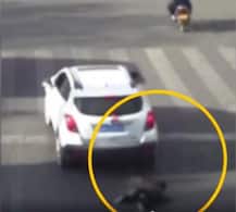 Viral video: Child luckily survives after falling from cab & being run over by SUV in China