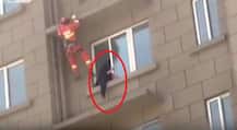 Footage: BRAVE firefighter puts his own life at risk to save suicidal woman in China