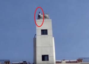 Caught on camera: Man jumps from 11-floor-building, find out what happens to him