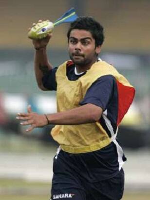 Did you notice what Virat Kohli carries in his hand?