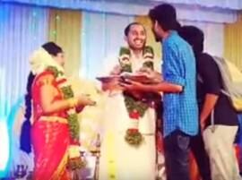 VIRAL VIDEO: BTech student attends professor's wedding only to get his record book signed VIRAL VIDEO: BTech student attends professor's wedding only to get his record book signed