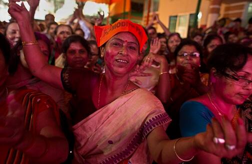 Bharatiya Janata Party, (BJP) supporters celebrate after winning Assam state election in Gauhati, India, Thursday, May 19, 2016. (AP Photo/ Anupam Nath)