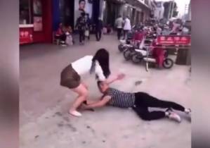 In public, man grabs girlfriend's leg, begs her not to go, video goes viral