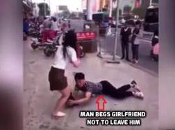 In public, man grabs girlfriend's leg, begs her not to go, video goes viral