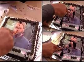 Cake with Owaisi's image cut on MNS chief Raj Thackeray's birthday Cake with Owaisi's image cut on MNS chief Raj Thackeray's birthday