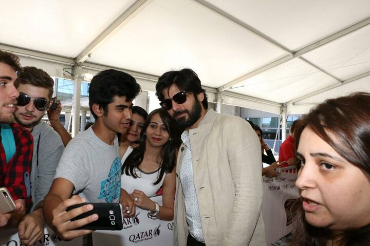 Looking sexy with a full grown beard, Fawad Khan makes fans happy by clicking pictures with them.