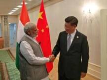 Judge India's NSG bid on 'merit', Modi tells Xi
