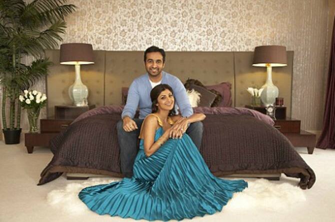 This is the bedroom of Mr. And Mrs. Kundra! Its high ceiling and is around 14 feet high, whichhas abstract antique tibetian door! Further more room has been given a very subtle look through white crushed curtains that flow across the window!
