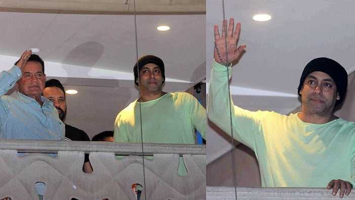 Salman Khan with his father Salim Khan waiving to fans on Eid