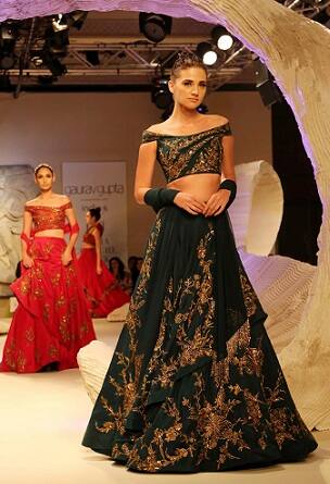 Model walks the ramp displaying an outfit by Gaurav Gupta