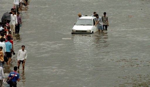 Eleven years ago, on this very day, Mumbai was deluged by heavy rainfall. Scroll below to look at tragic scenes in the Maximum City. (ALL PICS/AFP)