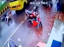 WATCH: Miraculous escape for two on a scooty after being dragged under a bus in MP's Gwalior