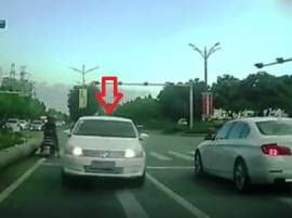 Road rage video: Car crashes into another sedan in front of it, what later's driver does will jolt you Road rage video: Car crashes into another sedan in front of it, what later's driver does will jolt you