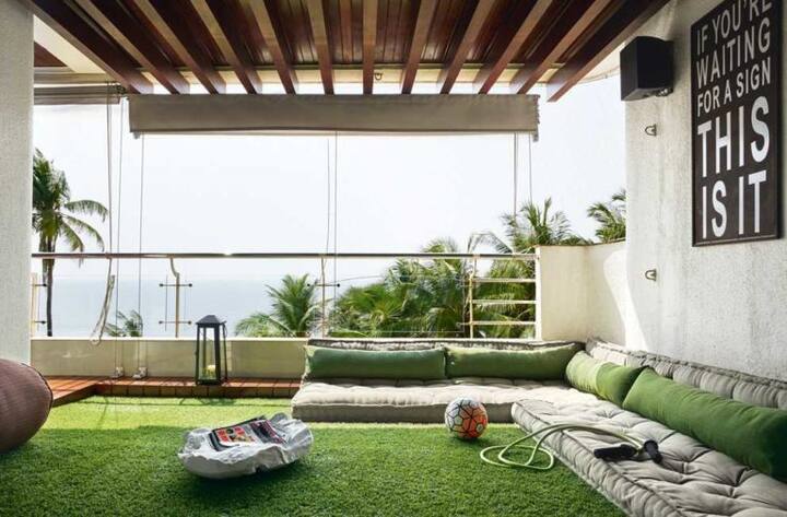Their lavish den open up to this enclosed green space which has sea-side view!