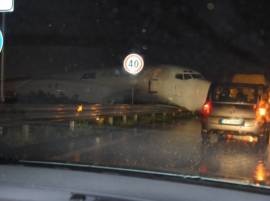 Cargo plane overshoots runway, crashes onto busy road Cargo plane overshoots runway, crashes onto busy road