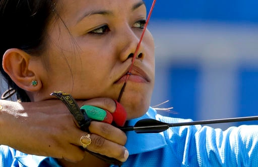 India's Bombayla Devi Laishram aims for the target during the women's team archery competition at the Sambadrome venue during the 2016 Summer Olympics in Rio de Janeiro, Brazil, Sunday, Aug. 7, 2016. (AP Photo/Natacha Pisarenko)