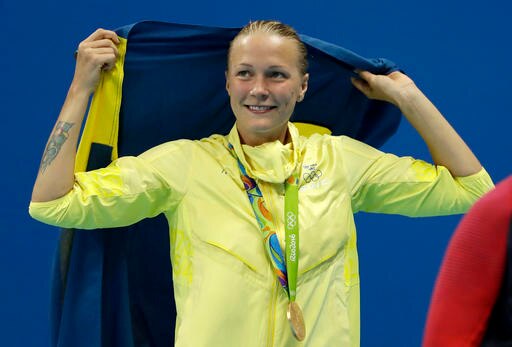 Sweden's Sarah Sjostrom celebrates winning a gold medal in the women's 100-meter butterfly during the swimming competitions at the 2016 Summer Olympics, Sunday, Aug. 7, 2016, in Rio de Janeiro, Brazil. (AP Photo/Matt Slocum)