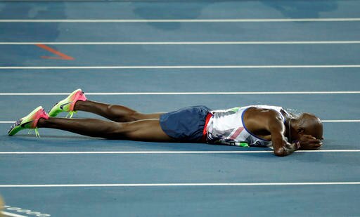 Britain's Mo Farah celebrates after winning the gold medal during the athletics competitions of the 2016 Summer Olympics at the Olympic stadium in Rio de Janeiro, Brazil. (AP)