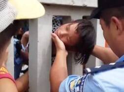 Watch: 8-year-old girl traps head between railway fence