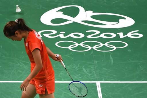 Japan's Nozomi Okuhara reacts against India's Pusarla V. Sindhu during their women's singles semi-final badminton match at the Riocentro stadium in Rio de Janeiro on August 18, 2016, at the Rio 2016 Olympic Games. India's Pusarla V. Sindhu won the match. / AFP PHOTO / GOH Chai Hin