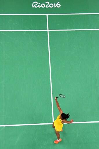 An overview shows India's Pusarla V. Sindhu reacts after winning against Japan's Nozomi Okuhara in Rio