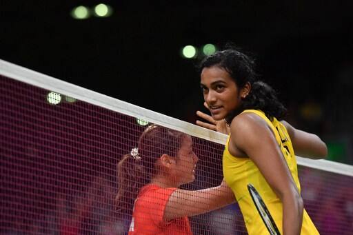 Pusarla V. Sindhu (R) reacts after winning against Japan's Nozomi Okuhara 