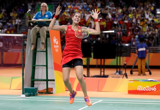 Spain's Carolina Marin celebrates after defeating India's V. Sindhu Pusarla in the women's badminton singles gold medal match at the 2016 Summer Olympics in Rio de Janeiro, Brazil, Friday, Aug. 19, 2016. (AP Photo/Kin Cheung)