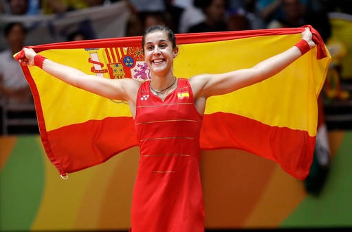 Spain's Carolina Marin celebrates after defeating India's V. Sindhu Pusarla in the women's badminton singles gold medal match at the 2016 Summer Olympics in Rio de Janeiro, Brazil, Friday, Aug. 19, 2016. (AP Photo/Kin Cheung)