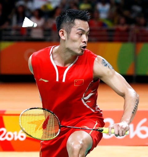 China's Lin Dan returns a shot to Malaysia's Lee Chong Wei during a men's badminton singles semifinal match at the 2016 Summer Olympics in Rio de Janeiro, Brazil, Friday, Aug. 19, 2016. (AP Photo/Vincent Thian)