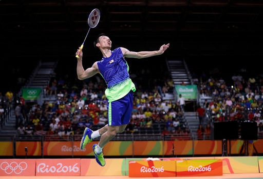 Malaysia's Lee Chong Wei returns a shot to China's Lin Dan during a men's badminton singles semifinal match at the 2016 Summer Olympics in Rio de Janeiro, Brazil, Friday, Aug. 19, 2016. (AP Photo/Kin Cheung)