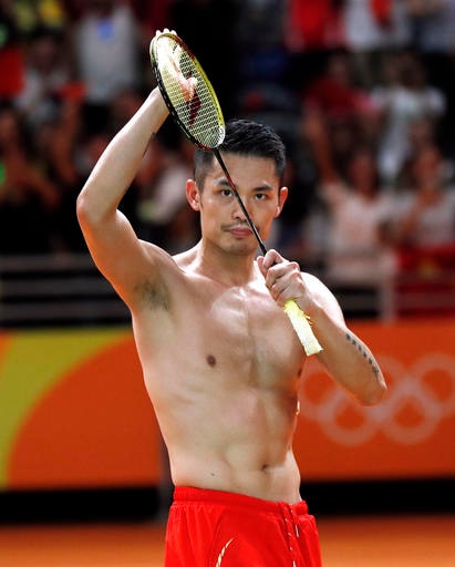China's Lin Dan applauds the crowd after losing to Malaysia's Lee Chong Wei in their men's badminton singles semifinal match at the 2016 Summer Olympics in Rio de Janeiro, Brazil, Friday, Aug. 19, 2016. (AP Photo/Vincent Thian)