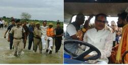 CM of Madhya Pradesh Shivraj Singh visits flood-hit areas of his state, carried across water by cops